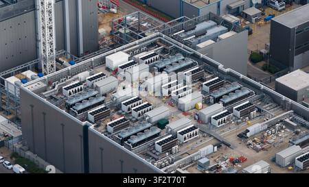 Aerial view of a large data center campus in Slough, showing HVAC systems, emergency backup power generators, cloud computing and massive digital infr Stock Photo