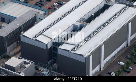 Aerial view of a large data center campus in Slough, showing HVAC systems, emergency backup power generators, cloud computing and massive digital infr Stock Photo