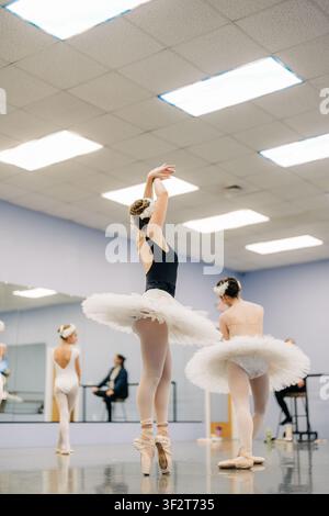 Young ballerinas rehearsing on pointe in ballet dance studio Stock Photo