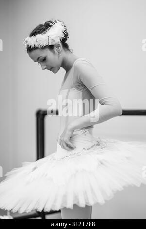 Ballerina preparing in white swan lake tutu Stock Photo