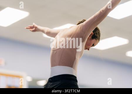 Female dancer practicing elegant movements during ballet rehearsal Stock Photo