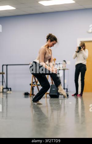 Dancer practicing movement in studio during rehearsal Stock Photo