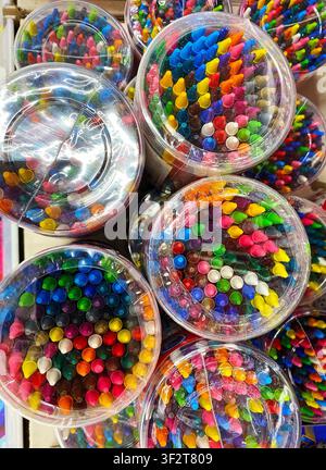 Colorful markers are neatly arranged in transparent containers on a display shelf, highlighting a variety of vibrant colors and tips for artistic use Stock Photo