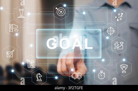Businessman pressing GOAL button on imaginary screen, collage with success icons Stock Photo