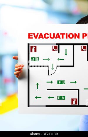 Emergency 911 evacuation plan displayed on a sign for safety in case of emergencies Stock Photo