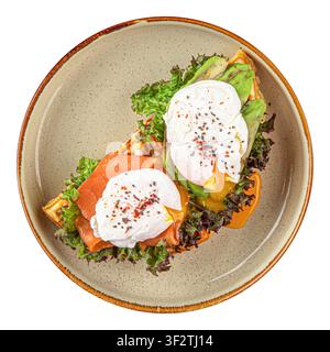Waffles with salmon and poached eggs isolated Stock Photo