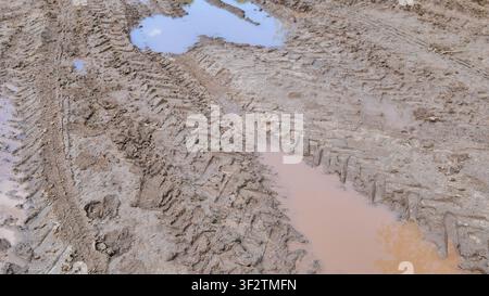Muddy Road With Large Puddles After Rain Stock Photo