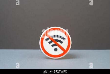 Icon indicating the absence of a Wi-Fi connection or a ban on its use. network unavailability, internet ban, connectivity error, and digital limitatio Stock Photo