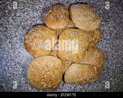 Photos and images of bread and rolls including wheat, rye, spelt, and sesame rolls some featuring decorative elements and text fields or space for tex Stock Photo
