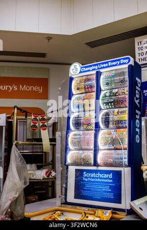 Leatherhead Surrey UK, July 20 2026, National Lottery Scratchcard Display Stand Inside A Sainsbury's Supermarket, No People Stock Photo