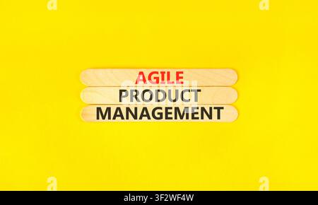 Agile product management words symbol. Concept words Agile product management on beautiful wooden sticks. Beautiful yellow background. Business agile Stock Photo