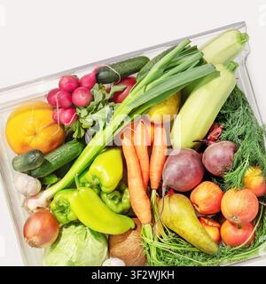 Refrigerator Crisper Drawer Filled with Fresh Fruits and Vegetables on White background Stock Photo