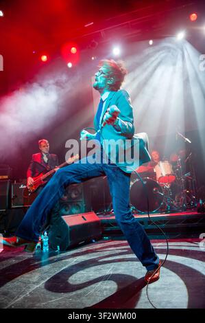 Jarvis Cocker, lead singer of the English alternative rock band Pulp, performing live on stage Stock Photo