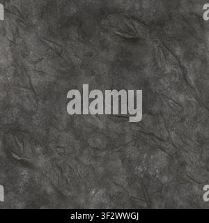 A dark grey stamped concrete or stone surface with stylized organic leaf-like indentations and a weathered texture. Stock Photo