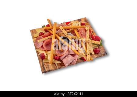 Charcuterie and Cheese Board with Breadsticks, Grapes, Strawberries and Mixed Cold Cuts Stock Photo