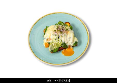 Eggs Benedict with Hollandaise Sauce, Spinach and Lime on Toasted Bread Stock Photo