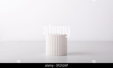 Decorative gypsum podium on white background. Minimal mock up. Stock Photo