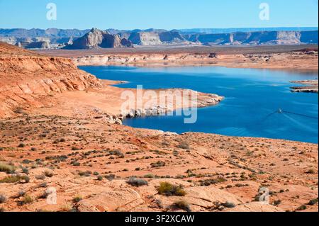 Boat on lake Powell, an artificial lake created on the Colorado River by the Glen Canyon Dam completed in 1963. Page. Arizona. USA. Stock Photo