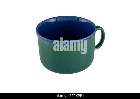 Green exterior and deep blue interior ceramic mug with handle photographed on a clean white background, ideal for kitchen, coffee, tea, product and e- Stock Photo