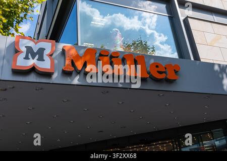 Mainz, Germany - July 18, 2026: Store sign shows Mueller with bright orange letters outside in Mainz Stock Photo