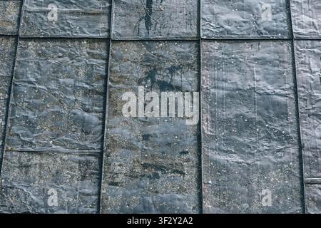 Weathered gray metal panels creating a grungy outdoor texture, full frame, abstract and industrial surface backdrop Stock Photo