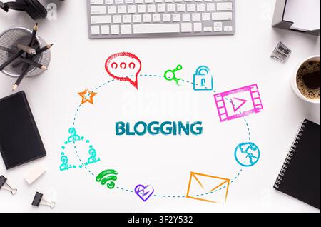 Word BLOGGING and web icons on office desk with gadgets and stationery, white background. Flat lay. Collage Stock Photo