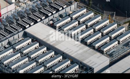 Aerial view of rooftop cooling systems on large data centers in Slough, showing cloud infrastructure, power demand and digital technology near London. Stock Photo