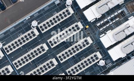 Aerial view of rooftop cooling systems on large data centers in Slough, showing cloud infrastructure, power demand and digital technology near London. Stock Photo