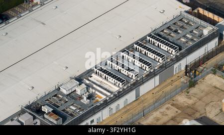 Aerial view of rooftop cooling systems on large data centers in Slough, showing cloud infrastructure, power demand and digital technology near London. Stock Photo