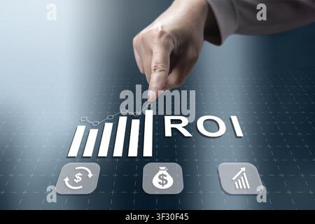 Digital interface featuring ROI metrics, a growth graph, and financial icons touched by a businessman, representing successful investment strategy and Stock Photo