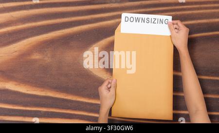A close-up view of a gray painted surface featuring vertical liquid streaks and drips, creating a grunge industrial background for design projects Stock Photo
