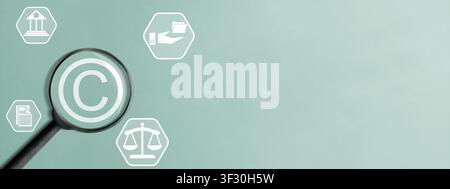 A magnifying glass over a copyright symbol surrounded by legal and document icons on a green background with ample copy space for text. Concept of int Stock Photo