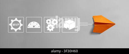 Conceptual image of MVP (Minimum Viable Product) showing business icons for process and product development leading to a successful launch with an ora Stock Photo