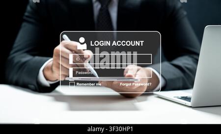 A man in a suit uses a tablet with a virtual login interface overlay. Concept of cyber security, data privacy, online banking, and digital identity au Stock Photo