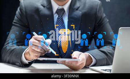 A businessman uses a tablet with AI graphics to select job candidates, representing modern HR technology, recruitment automation, and talent acquisiti Stock Photo