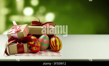 Painted Easter eggs with unique patterns and three brown gift boxes tied with pink and red ribbons on a white surface. Scene is set against a blurred Stock Photo