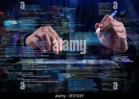 Programmer typing on virtual keyboard with glowing digital code overlay. Concept of software development, computer programming, cybersecurity, artific Stock Photo