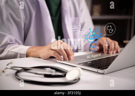 Doctor typing on laptop with AI Agent hologram, medical chatbot icons, and stethoscope. artificial intelligence assistant in healthcare, smart hospita Stock Photo