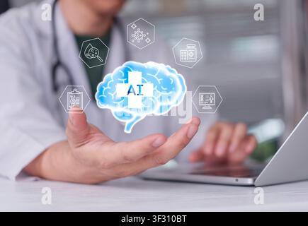 Doctor hand holding virtual brain with AI text and medical icons over laptop. Concept of Artificial Intelligence in Healthcare, machine learning diagn Stock Photo