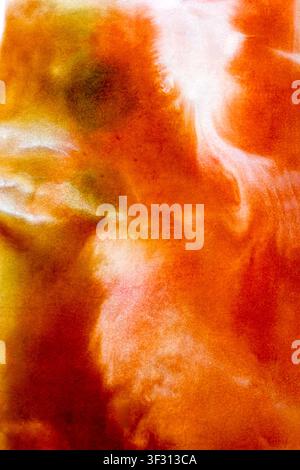 Vertical abstract background with vibrant orange and red watercolor swirls, creating a fluid, smoky effect with hints of yellow and green for a fiery, Stock Photo
