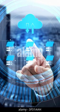 A businessman touches a futuristic digital interface representing cloud computing, data management, and file synchronization against a blurred city ba Stock Photo