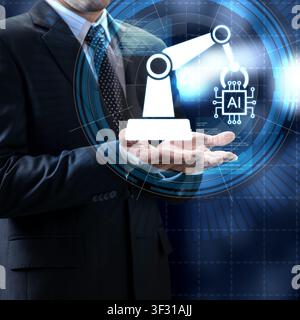 A businessman presenting a futuristic holographic concept of an AI-powered robotic arm, representing digital transformation and automation in modern m Stock Photo