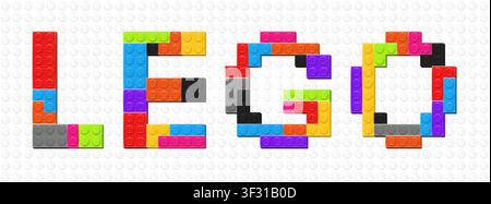 Realistic LEGO inscription made with colored plastik constructor parts on white constructor plate background. Play and build concept. Vector editorial Stock Vector