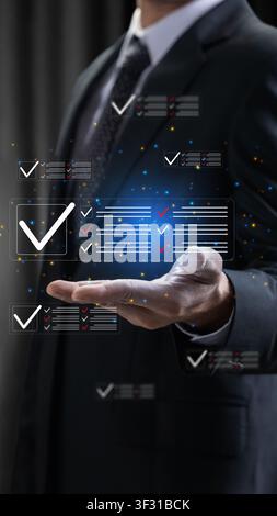 A professional businessman interacts with a futuristic digital interface showing completed checklists, symbolizing task management, quality control, a Stock Photo