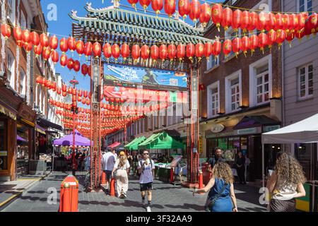 Red Chinese lanterns suspended over street in Chinatown, Gerard Street, Soho, London, England, UK Stock Photo