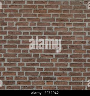 A dark red and brown weathered clay brick wall seamless texture with grey mortar joints. Stock Photo