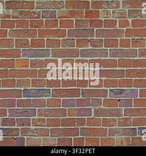 A wall composed of multi-colored textured clay bricks in shades of red and purple. Stock Photo