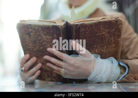 Person holding antique book Stock Photo