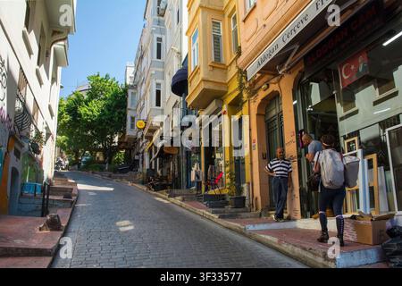 Istanbul, Turkiye – July 8th 2025. Yeni Carsi Caddesi in the Kuloglu district of Cukurcuma in Beyoglu. A long sloping street paved with stone setts Stock Photo