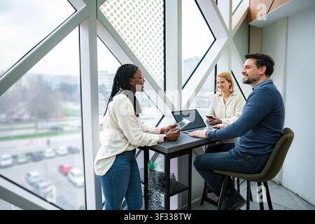Professional diverse business team meeting together Stock Photo